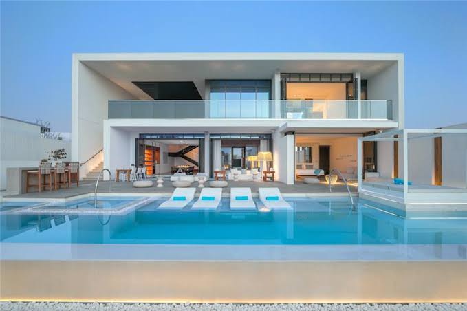 Luxury Dubai villa outdoor entertainment area with swimming pool